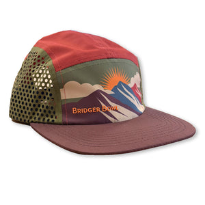 Cap with mountain design and 'Bridger Bow' branding on a white background